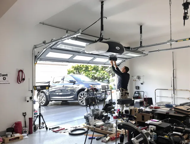 Ravenna Garage Door Repair specialist installing smart garage door opener system in Ravenna home
