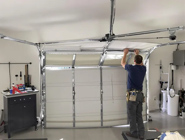 Ravenna Garage Door Repair specialist performing precise section replacement on Ravenna garage door